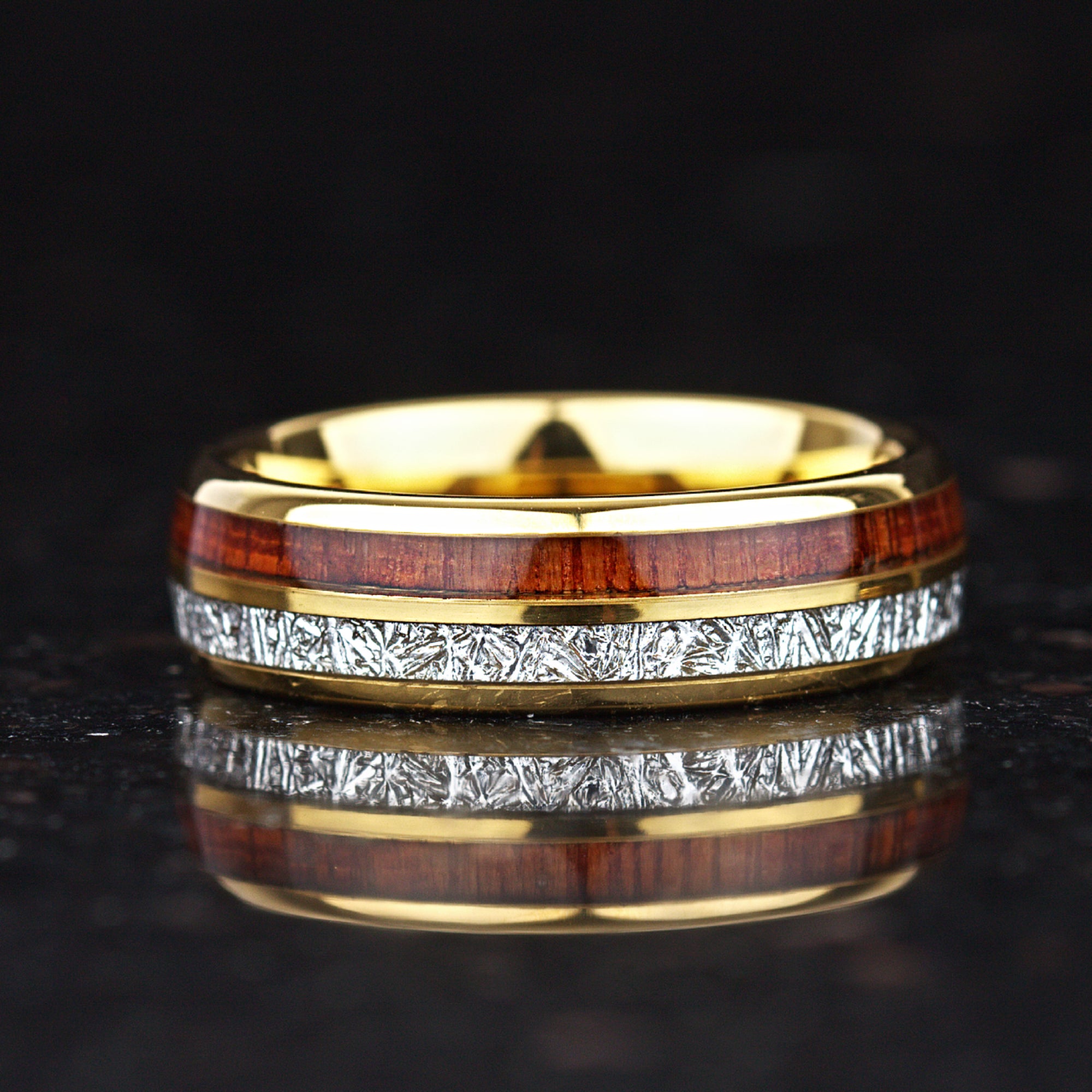 His and hers gold rings with wood and textured inlay design