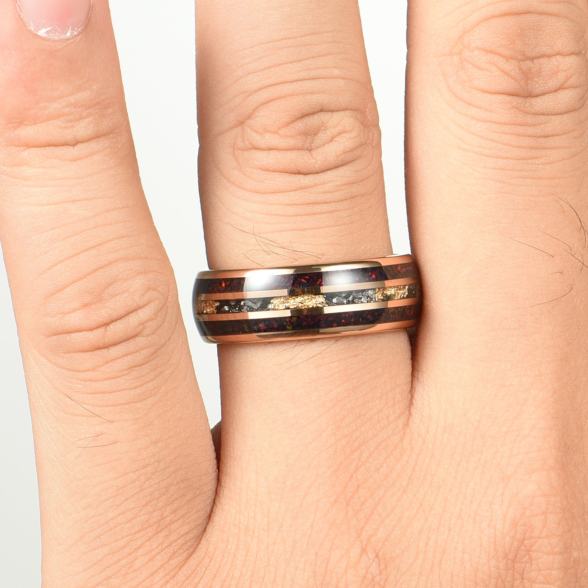 His and Hers Opal Wedding Rings with Meteorite Inlay Male Hand View