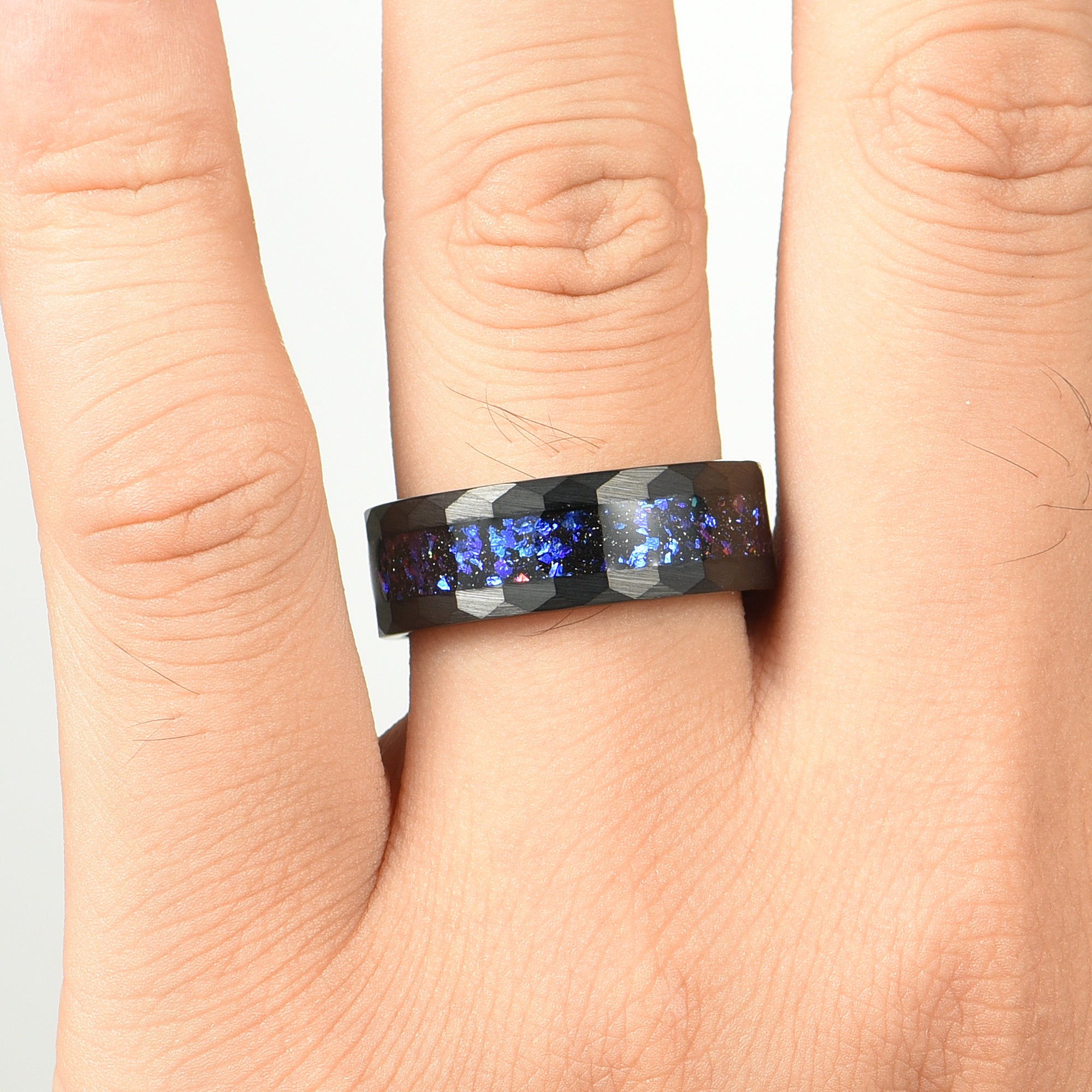 His and Hers Black Tungsten Wedding Rings with Orion Nebula Design Male Hand View