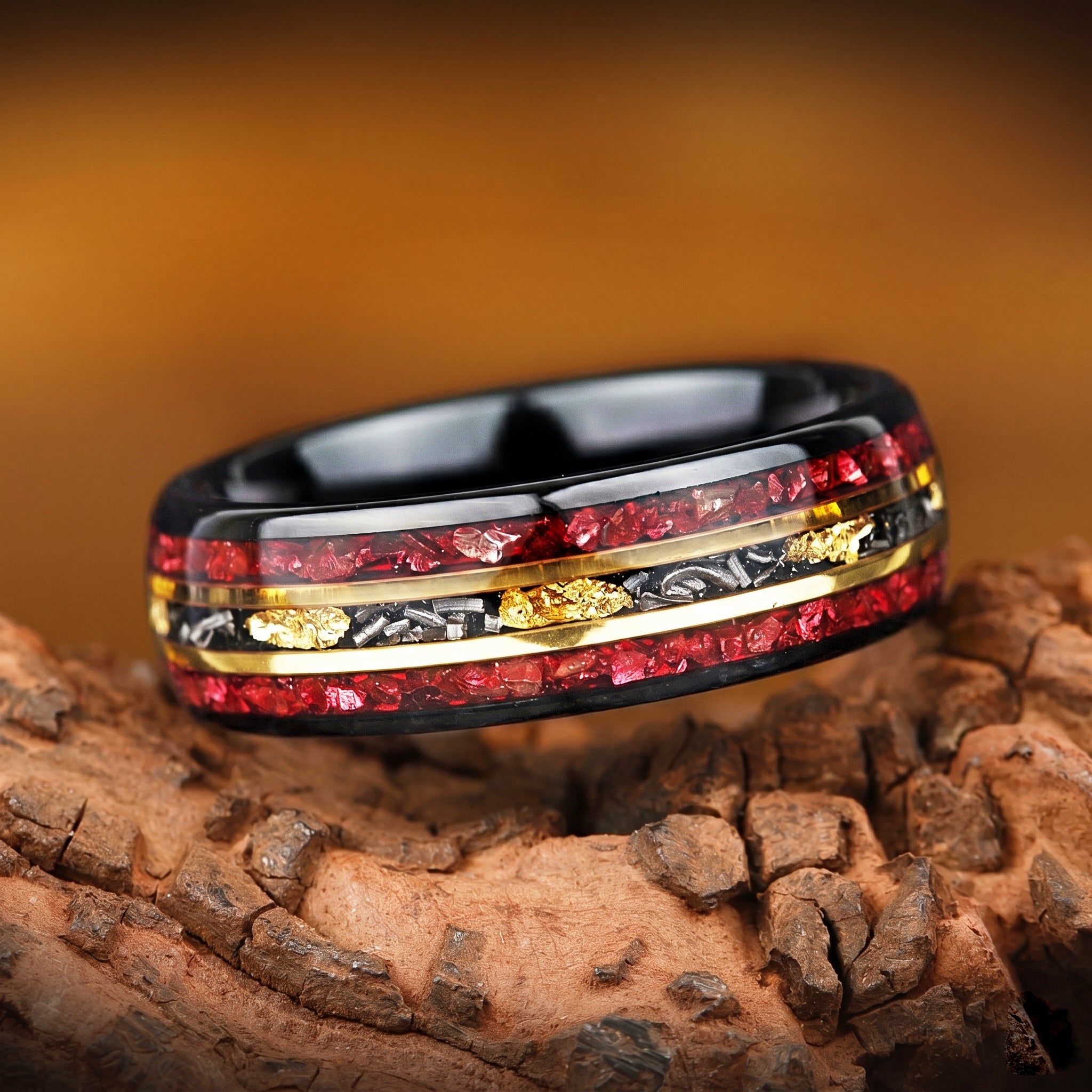 Meteorite jewelry ring with red garnet and gold leaf detail close up