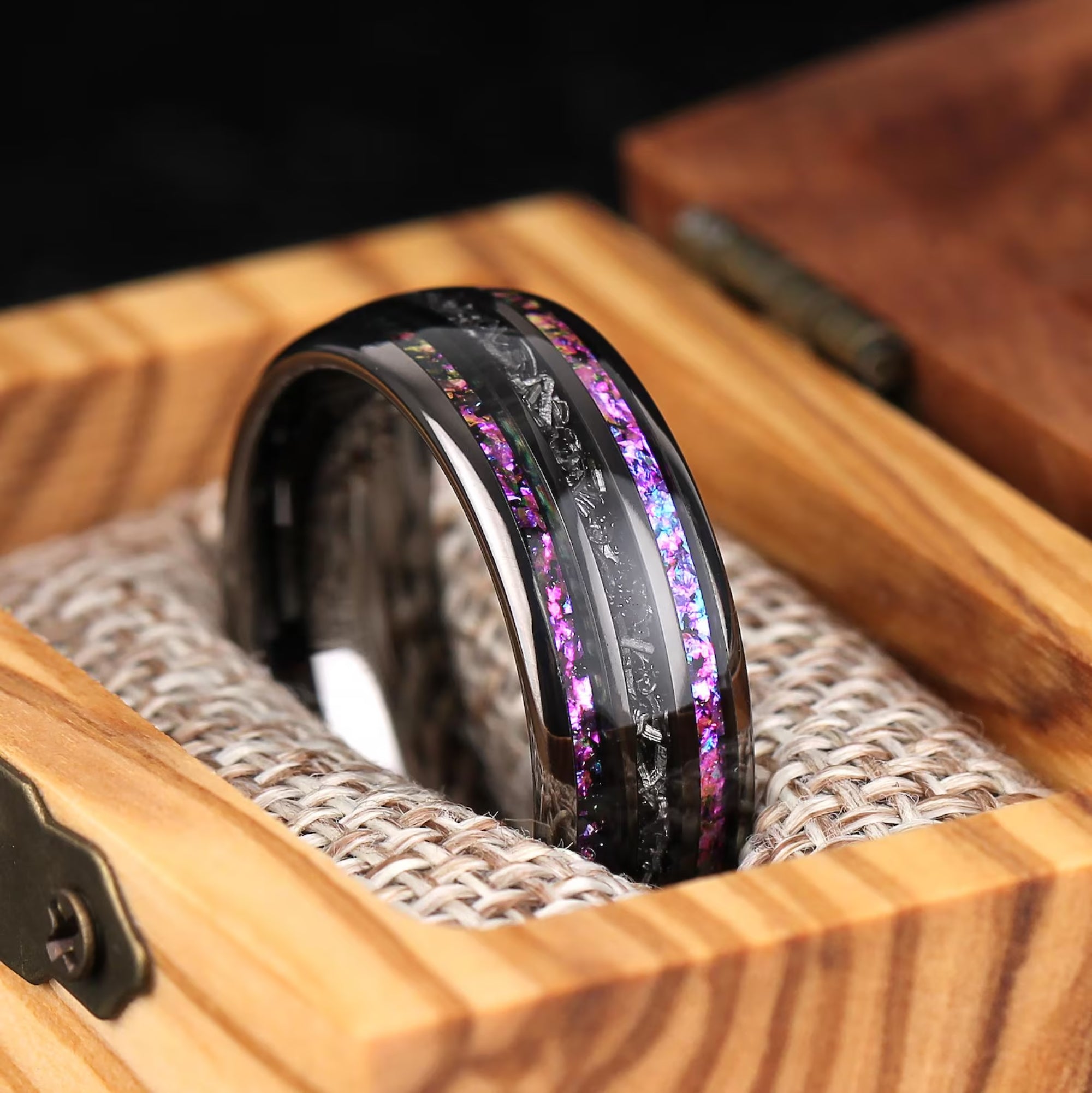Close up of meteorite and nebula inlay in black tungsten ring