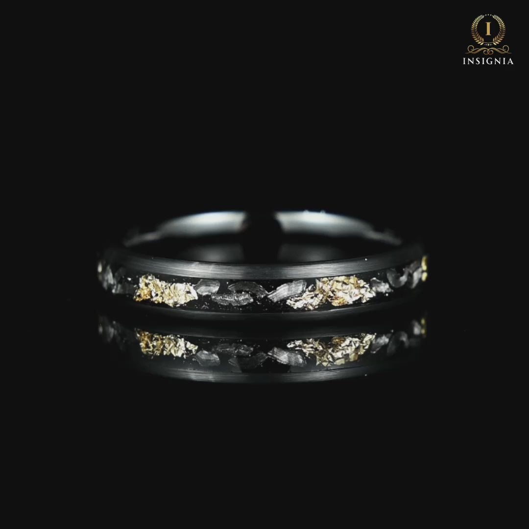ladies wedding band with real meteorite and gold leaf rotating on black glass