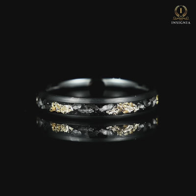 ladies wedding band with real meteorite and gold leaf rotating on black glass