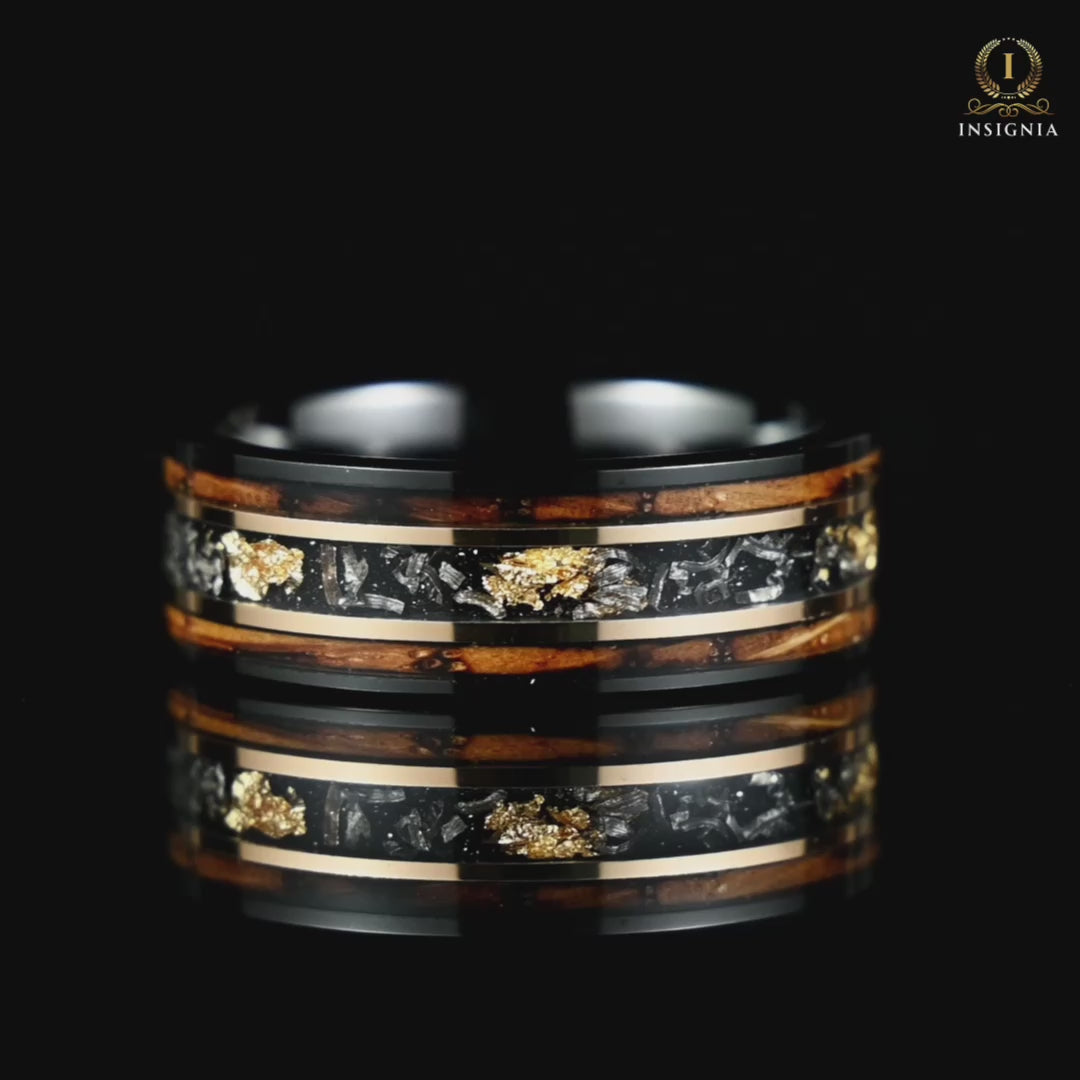 A video of a Mens Black Wedding Band with Meteorite and Smoked Wood rotating on a reflective black glass surface, highlighting its design.