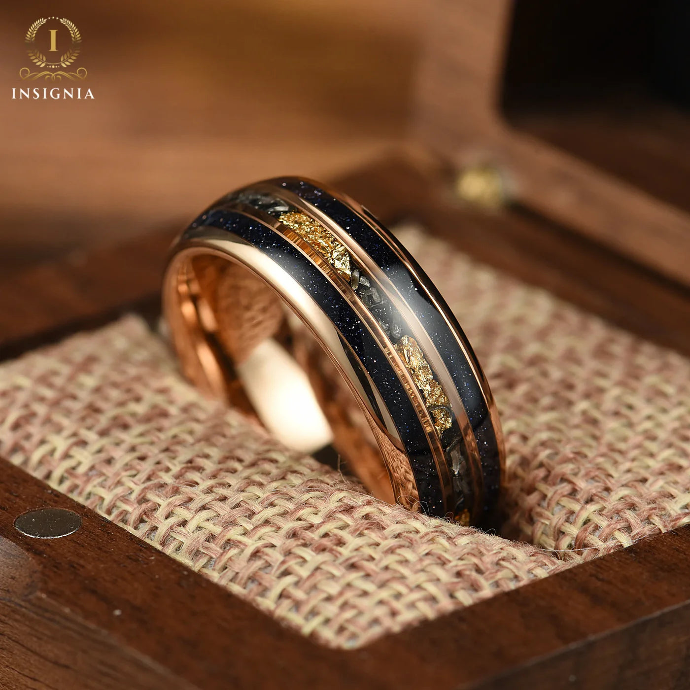 Rose gold commitment rings set with tungsten carbide and blue sandstone band