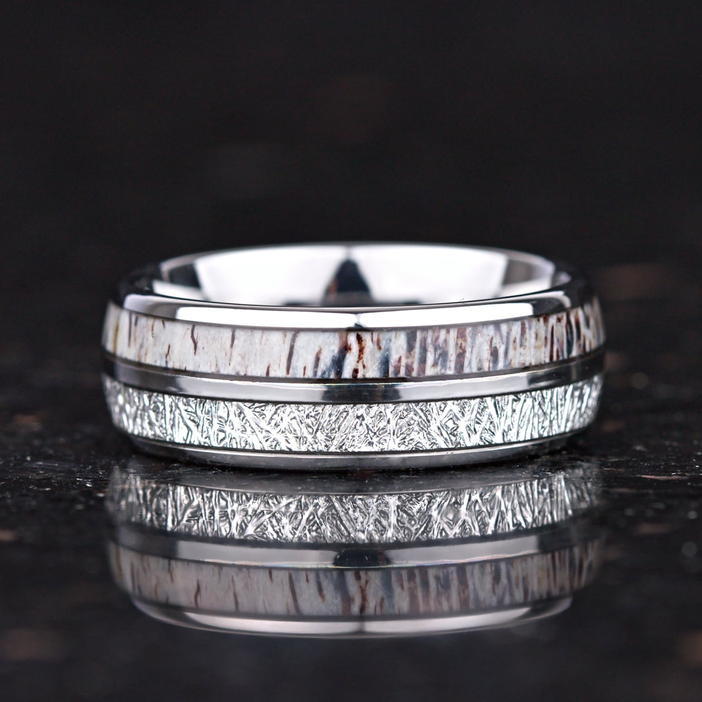 Uncommon wedding rings with meteorite and antler detail in tungsten band