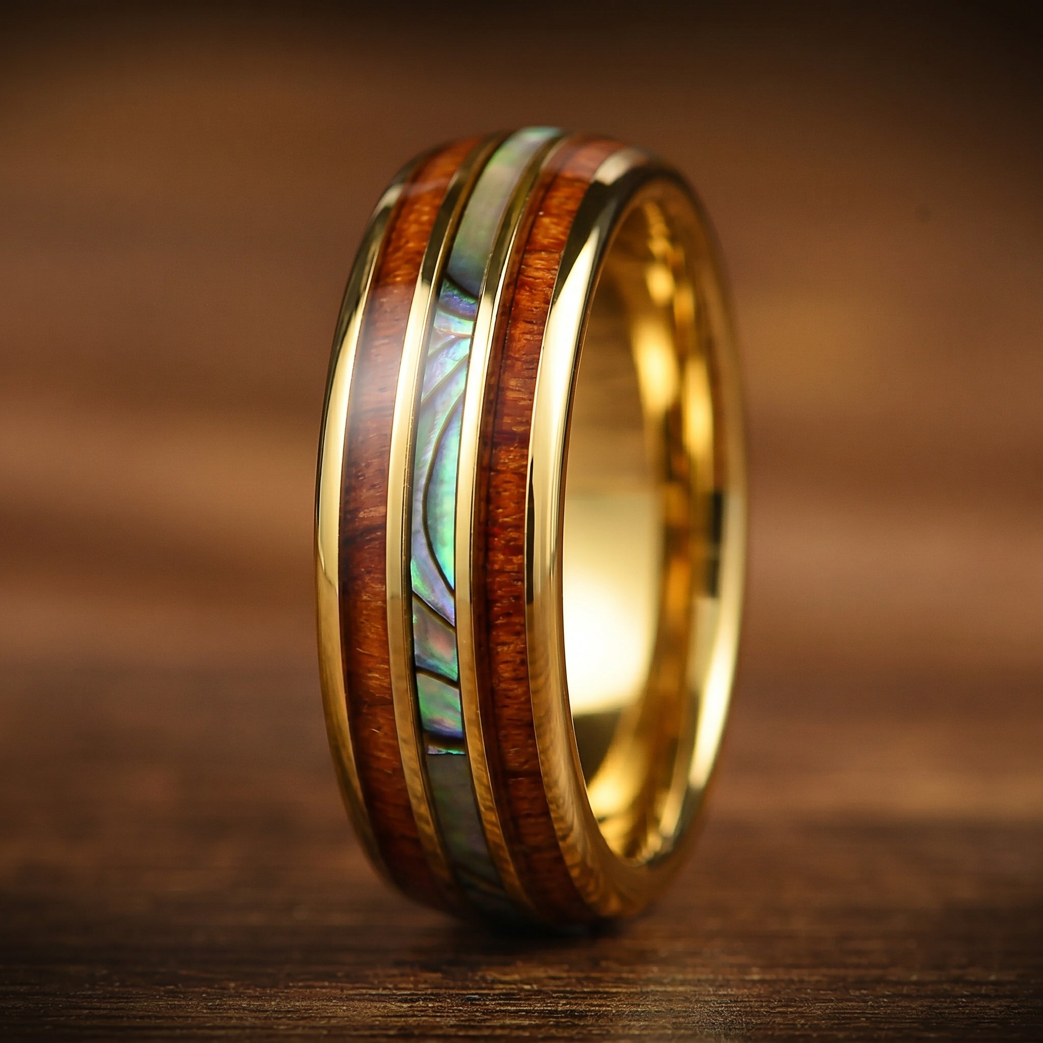 Uncommon wedding rings with colourful abalone shell and wood inlay detail