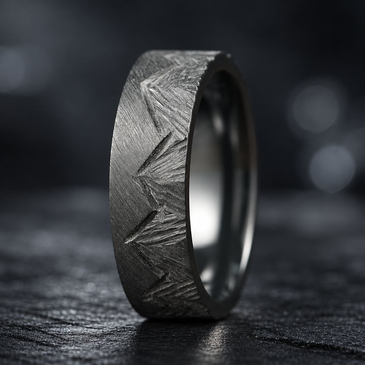 Unique marriage rings with carved mountain detailing in brushed zirconium
