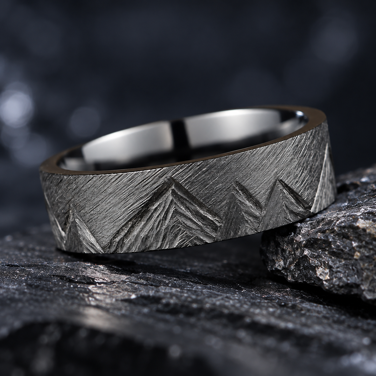Unique wedding bands in brushed zirconium with hand-carved mountain peaks