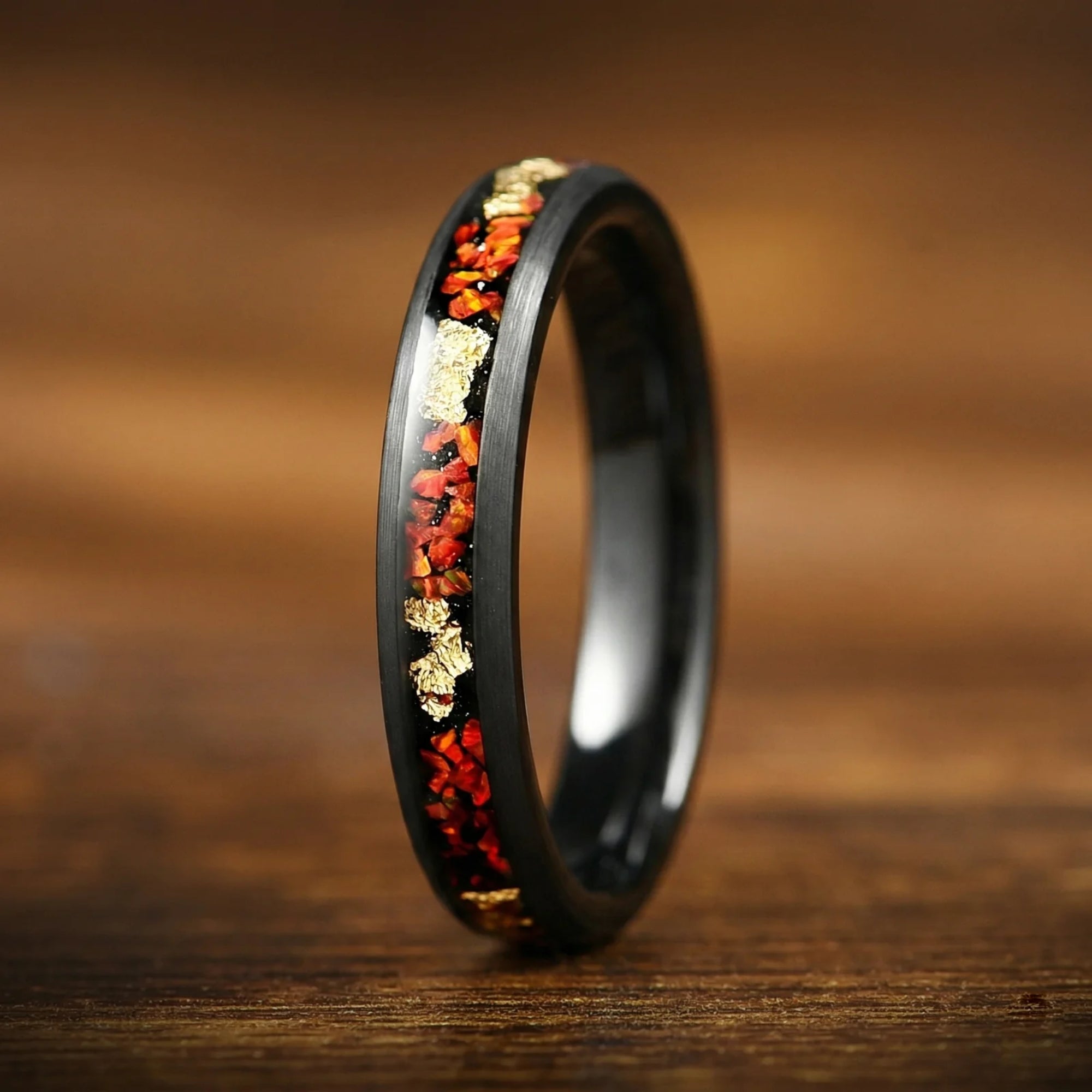 Wedding bands for him and her showing female ring with fire opal detail