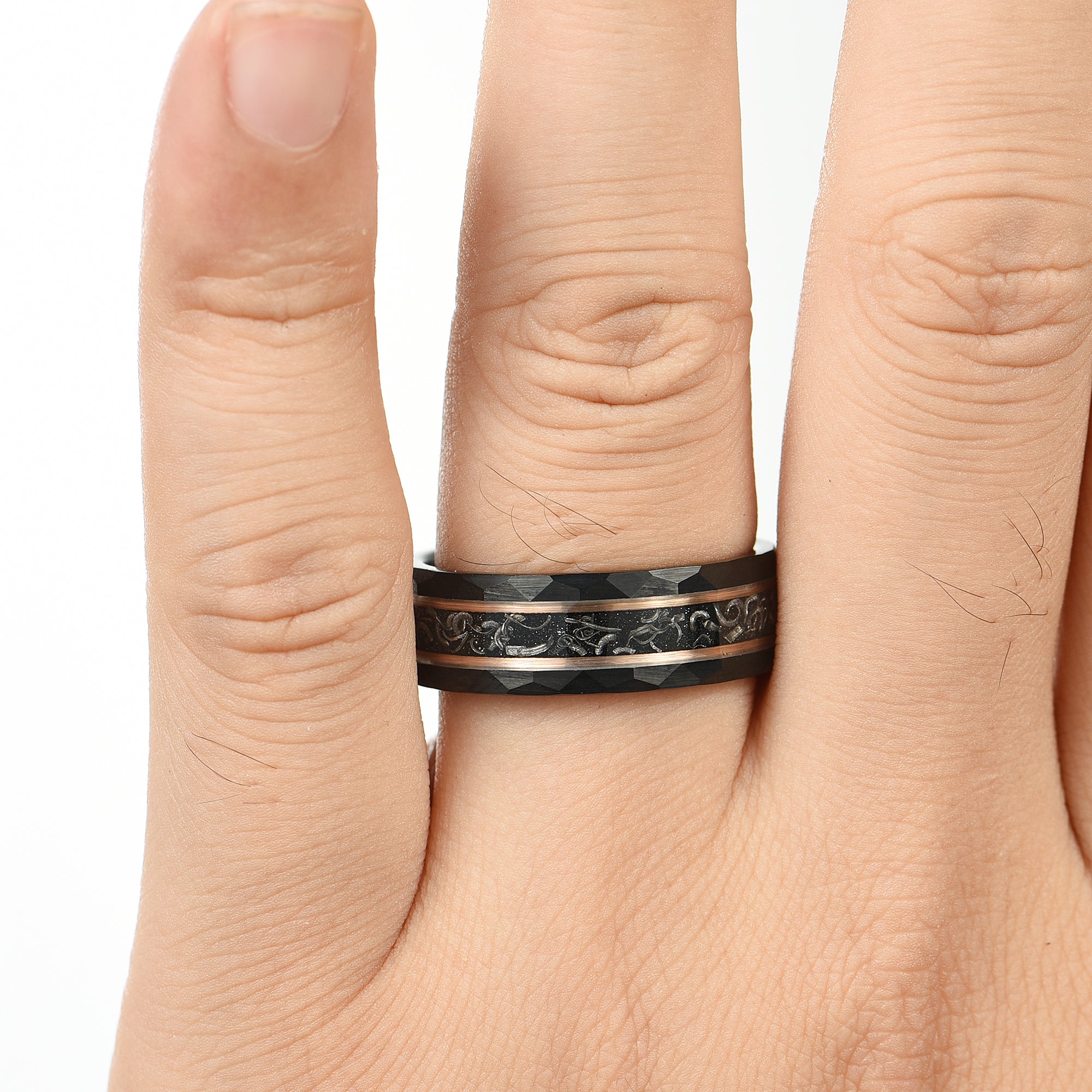 Wedding ring men hammered black band with meteorite inlay male hand view