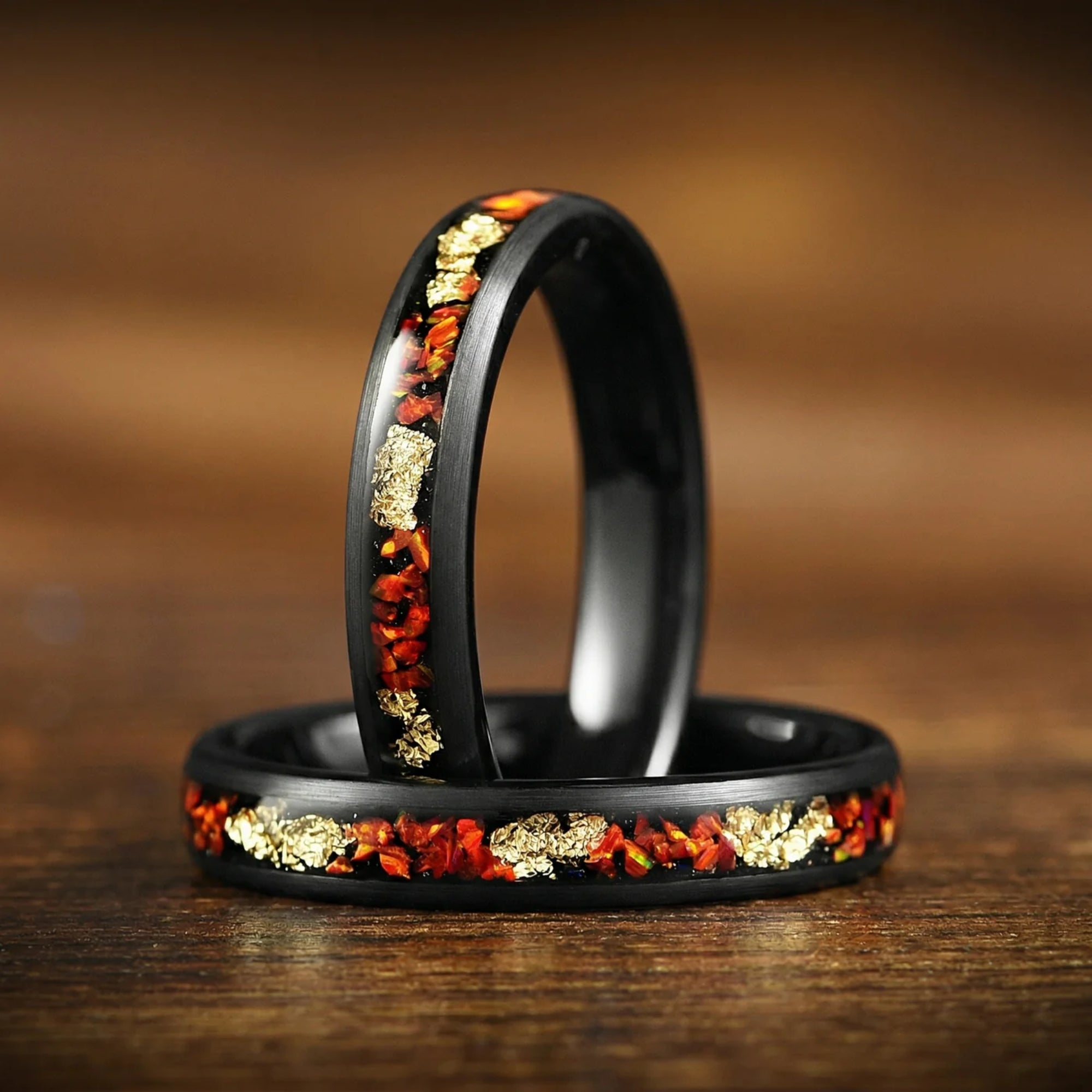 Wedding rings for men and women featuring female ring with fire opal inlay